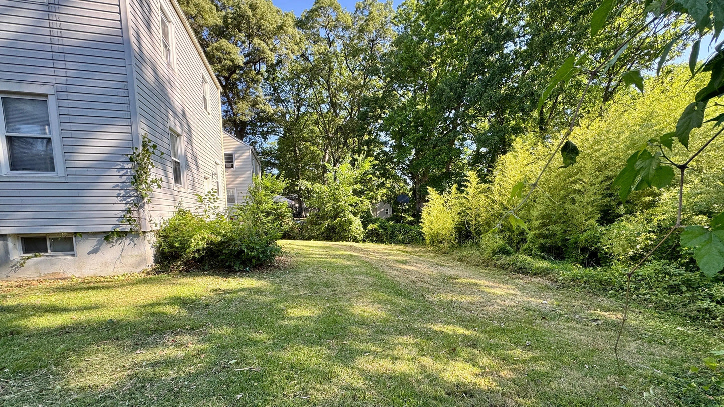 Lush green yard showcasing lawn maintenance services Maryland for vibrant outdoor living areas